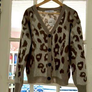 Size small cozy cardigan with leopard print.  Never worn.  Tags still attached!